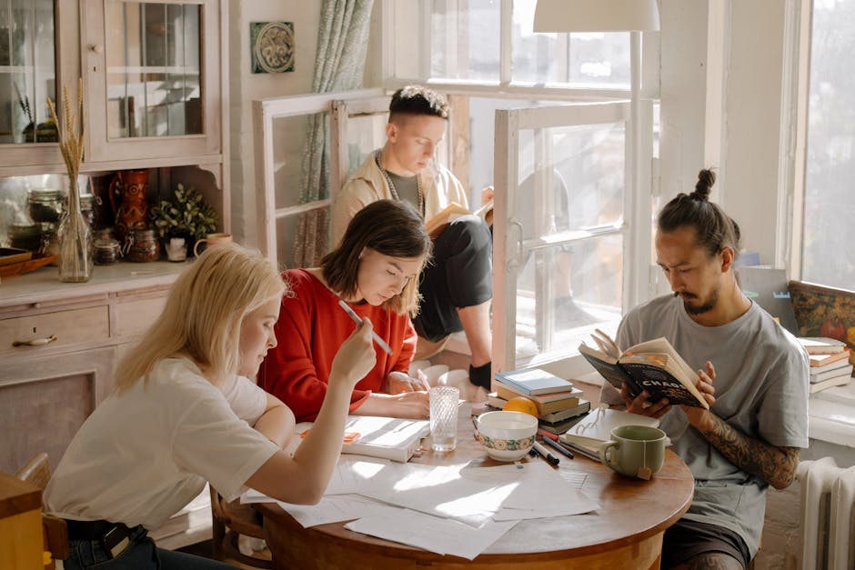 College students studying in bright room